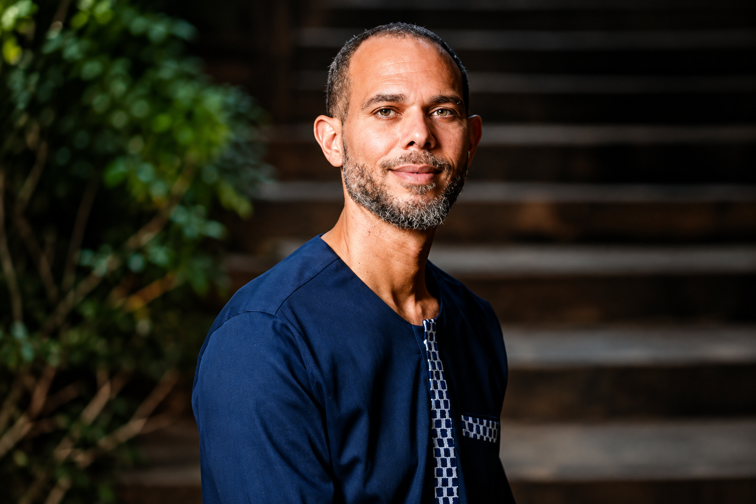 Professional portrait of a man wearing a navy traditional outfit