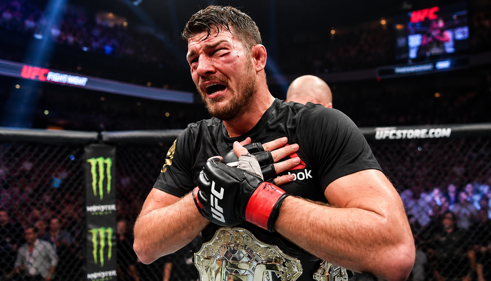 Michael Bisping holding the UFC championship belt after a fight