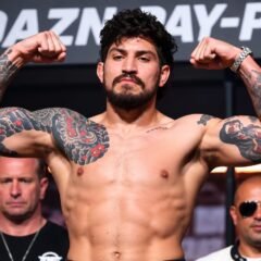 Dillon Danis net worth 2026 – flexing his muscles at a fight event