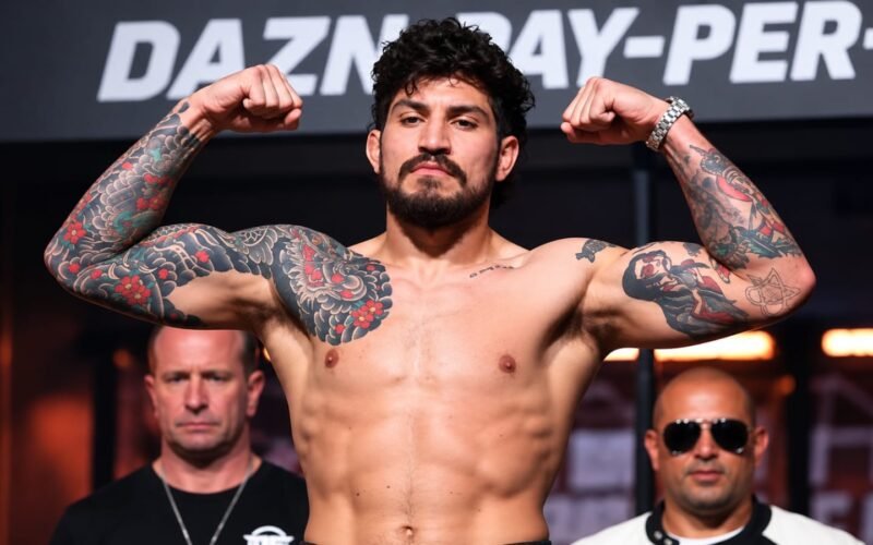 Dillon Danis net worth 2026 – flexing his muscles at a fight event