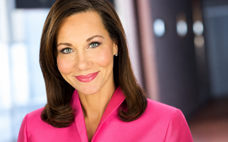 Lori Pinson net worth 2026 – smiling in a bright pink blazer