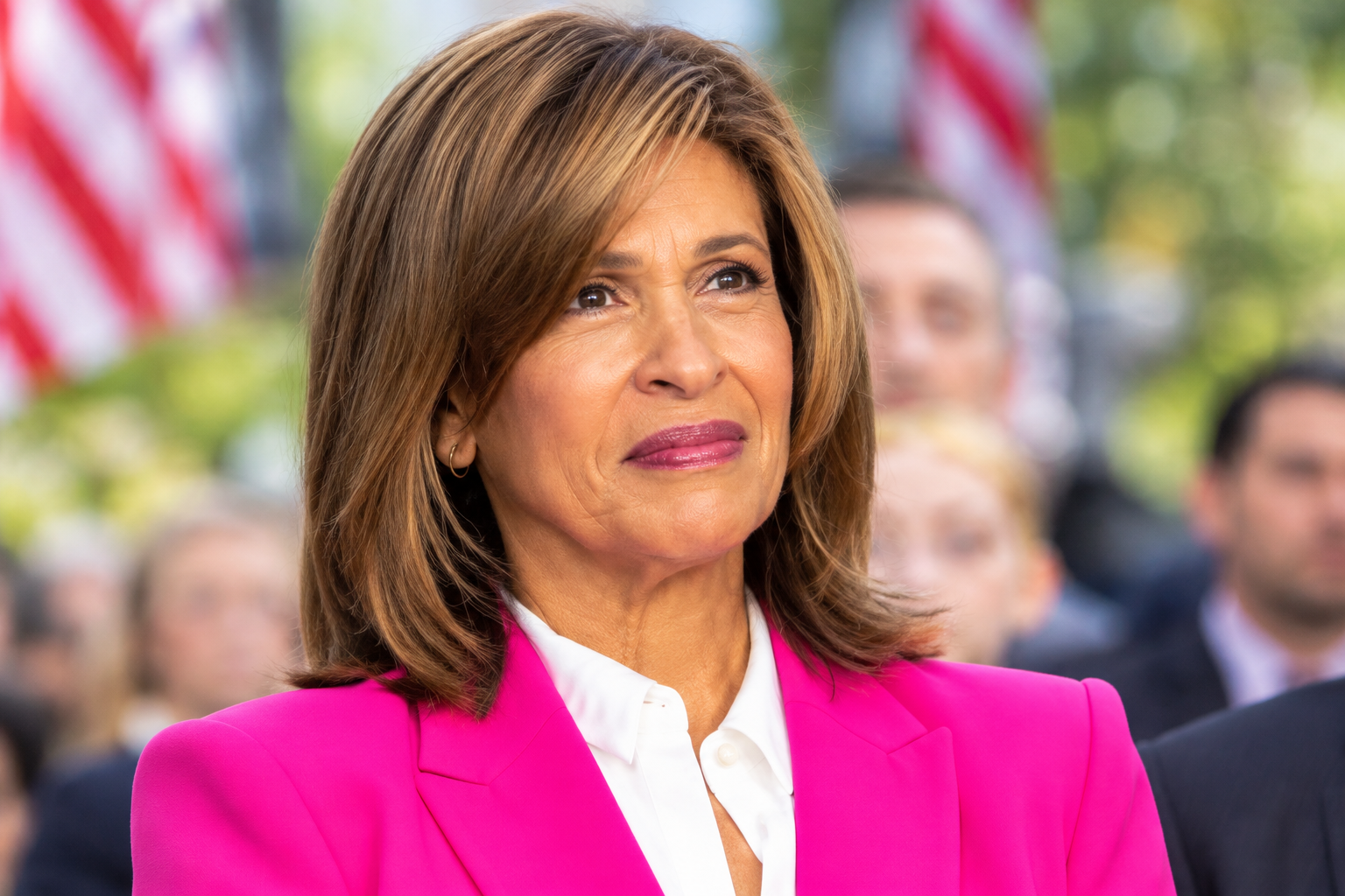 Hoda Kotb net worth 2026 – smiling in a bright pink blazer at a public event