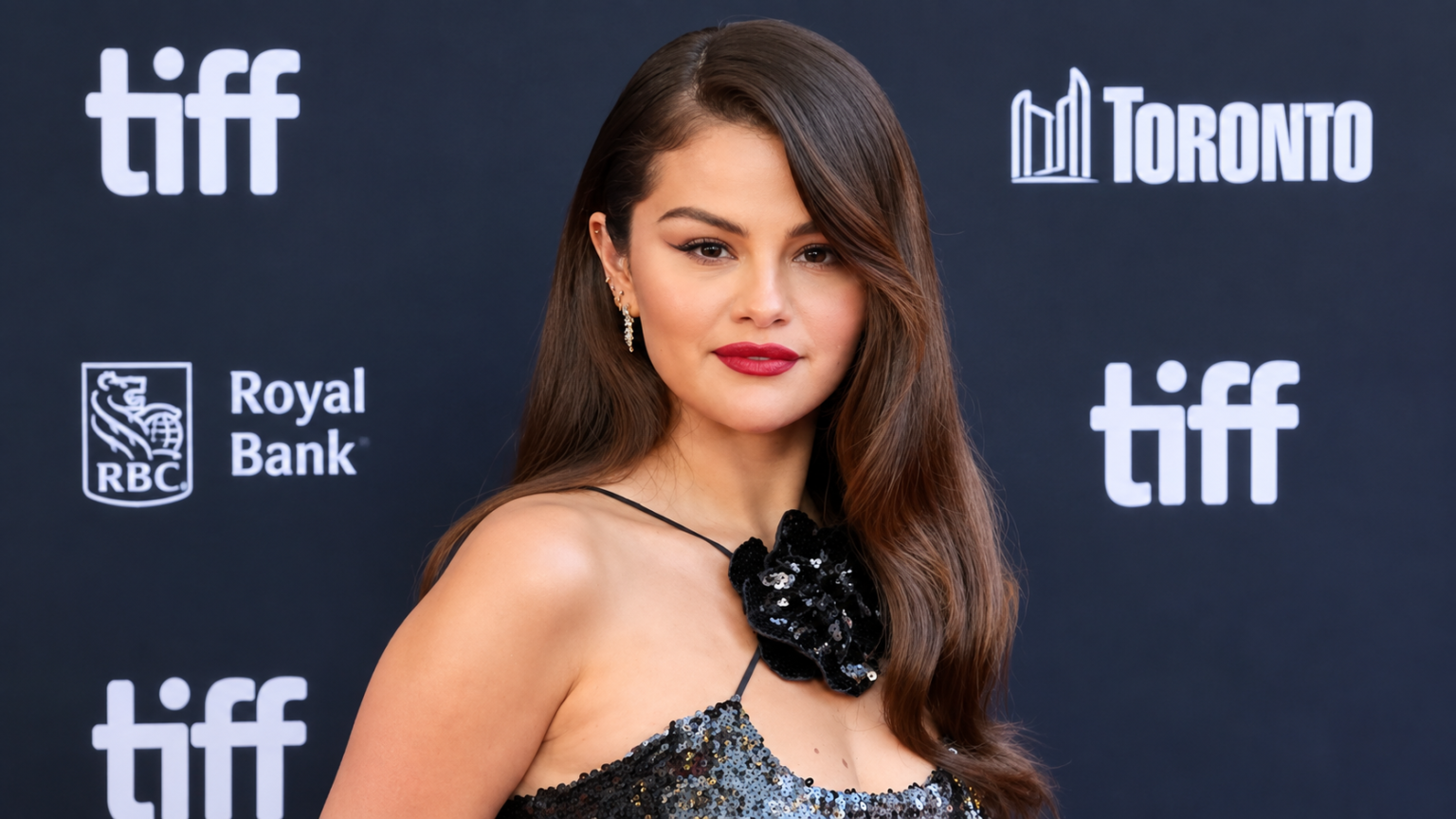 Selena Gomez net worth 2026 – wearing a black sequined dress at the Toronto International Film Festival
