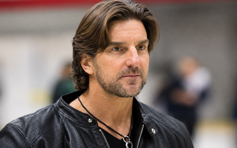 Brett James net worth 2026 – wearing a black leather jacket in a candid portrait