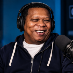 Mannie Fresh net worth 2026 – professional portrait in a podcast studio with headphones and microphone