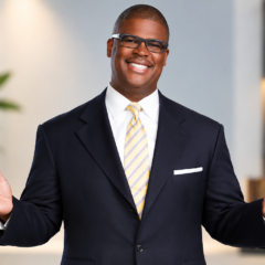 Charles Payne net worth 2026 – professional portrait in a suit and glasses