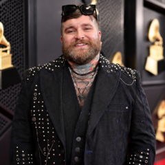 Teddy Swims net worth 2026 – professional portrait wearing a black studded outfit at a music event