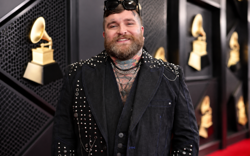 Teddy Swims net worth 2026 – professional portrait wearing a black studded outfit at a music event