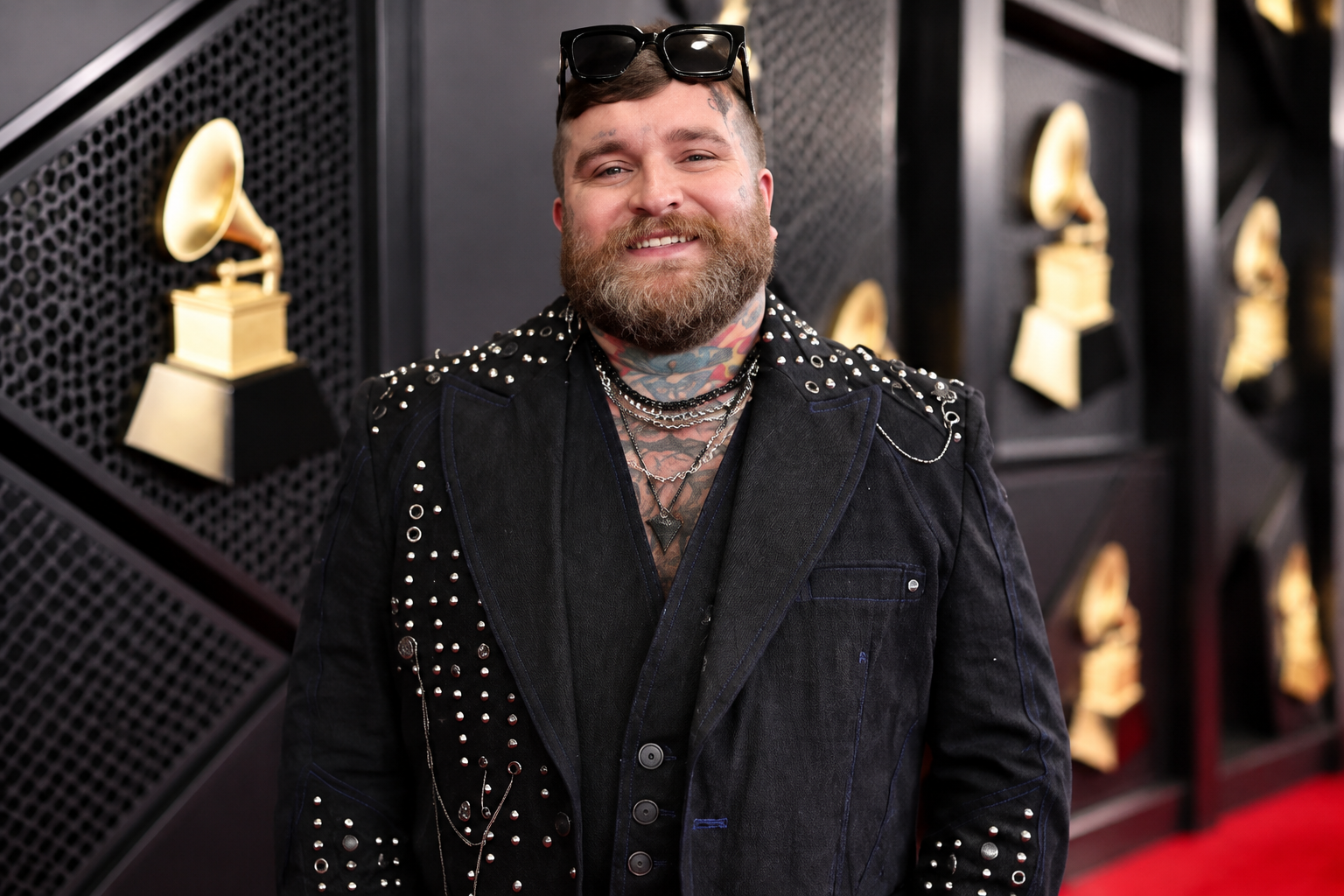Teddy Swims net worth 2026 – professional portrait wearing a black studded outfit at a music event
