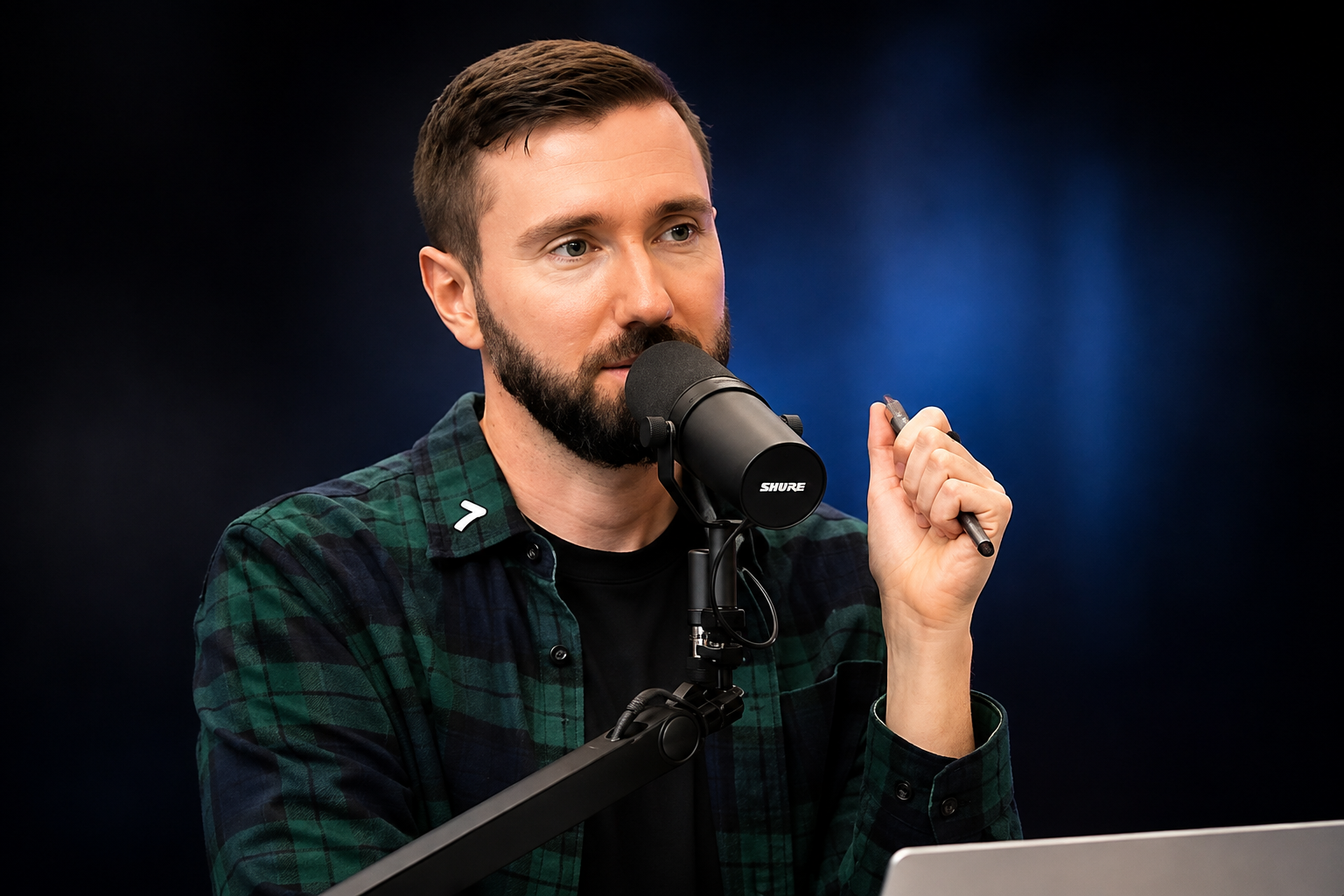 Brian Atlas net worth 2026 – speaking into a microphone during a podcast