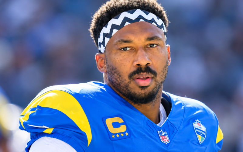 Myles Garrett net worth 2026 – wearing a blue and yellow football jersey and headband