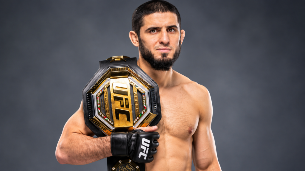 Islam Makhachev net worth 2026 – posing with a UFC championship belt