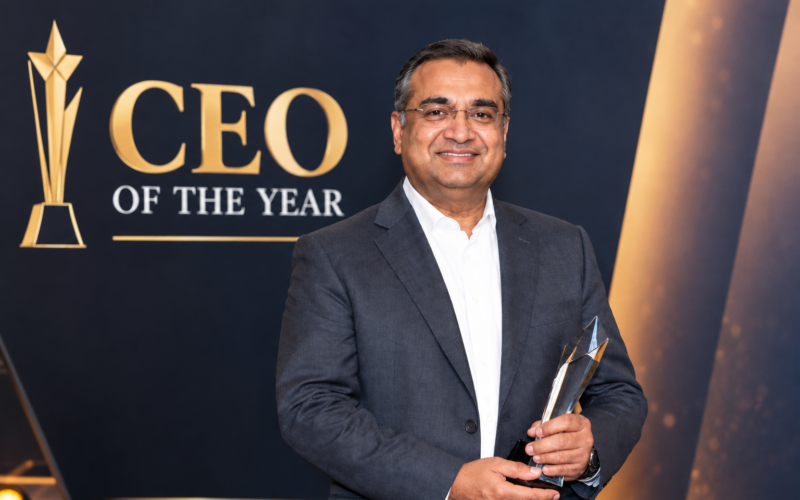 Neal Mohan holding an award at a CEO of the Year event