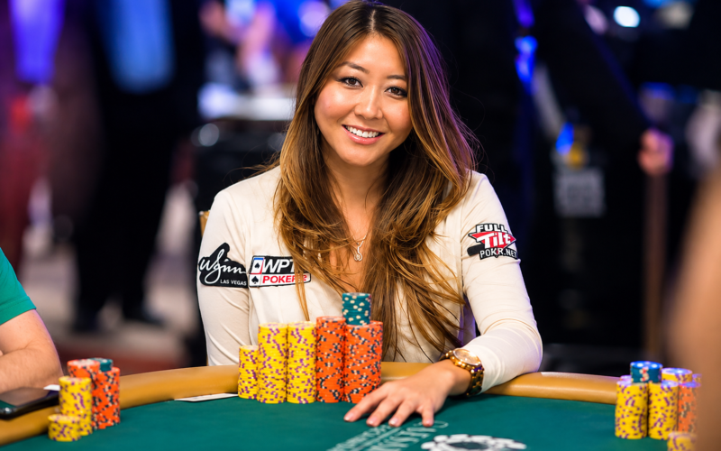 Maria Ho playing poker at a tournament table with poker chips