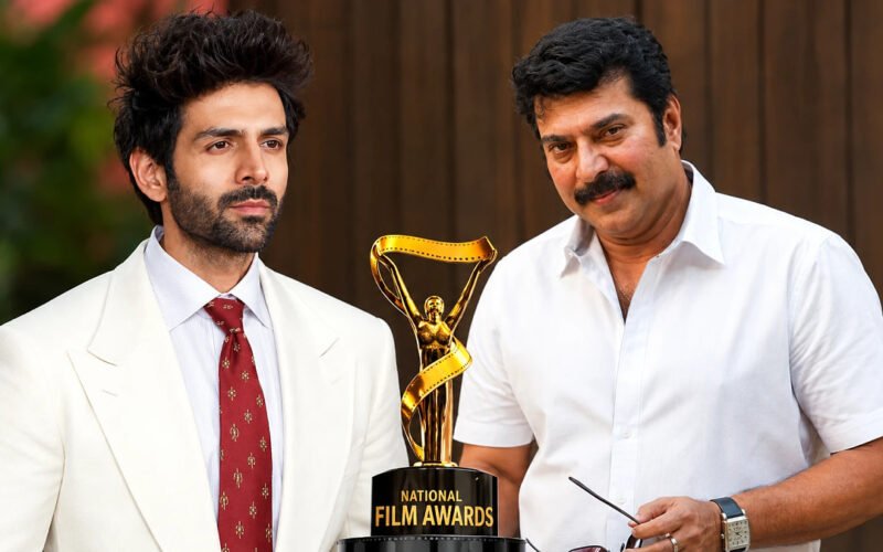 National Film Awards trophy displayed between two Indian actors