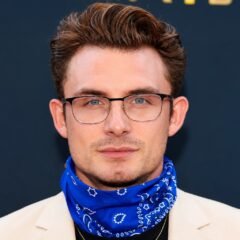 James Kennedy wearing glasses and a blue bandana