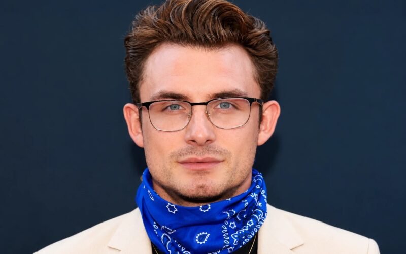 James Kennedy wearing glasses and a blue bandana