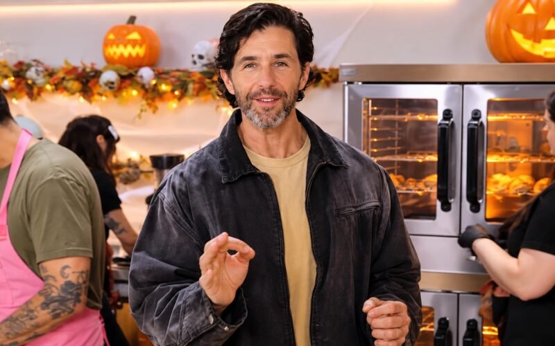 Sweet Deceit cast member in a Halloween-themed kitchen setting